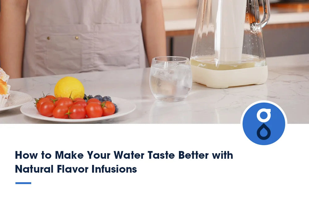 A glass pitcher filled with infused water, along with a glass of water and a plate of fresh fruits and vegetables on a marble countertop