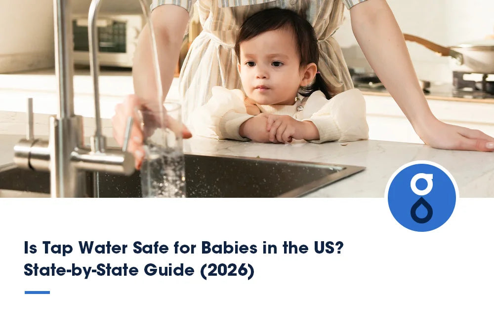 A mom and her baby getting a glass of tap water