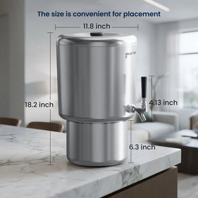 Stainless steel water filter with dimensions labeled on a kitchen counter.
